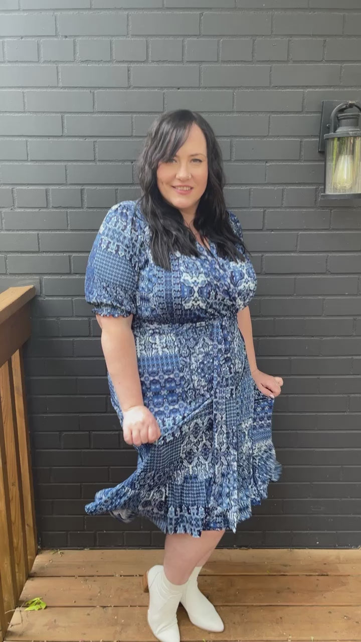 Load and play video in Gallery viewer, Blue Ruffle Hem Wrap Dress
